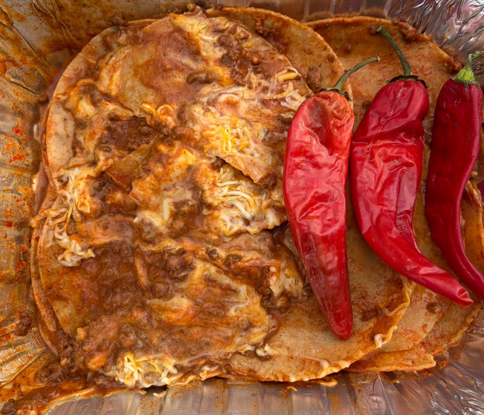 If you are lucky enough to make it to Wagner’s, you are lucky enough!  The Wagner family and people of Corrales are down to earth kind people.  As I was leaving, they offered me these enchiladas.  I said sure, and asked who made them.  One of the Wagner’s who was outside roasting 40 bushels of green chilis said, “I don’t know, someone dropped them off and we have one extra tray!”